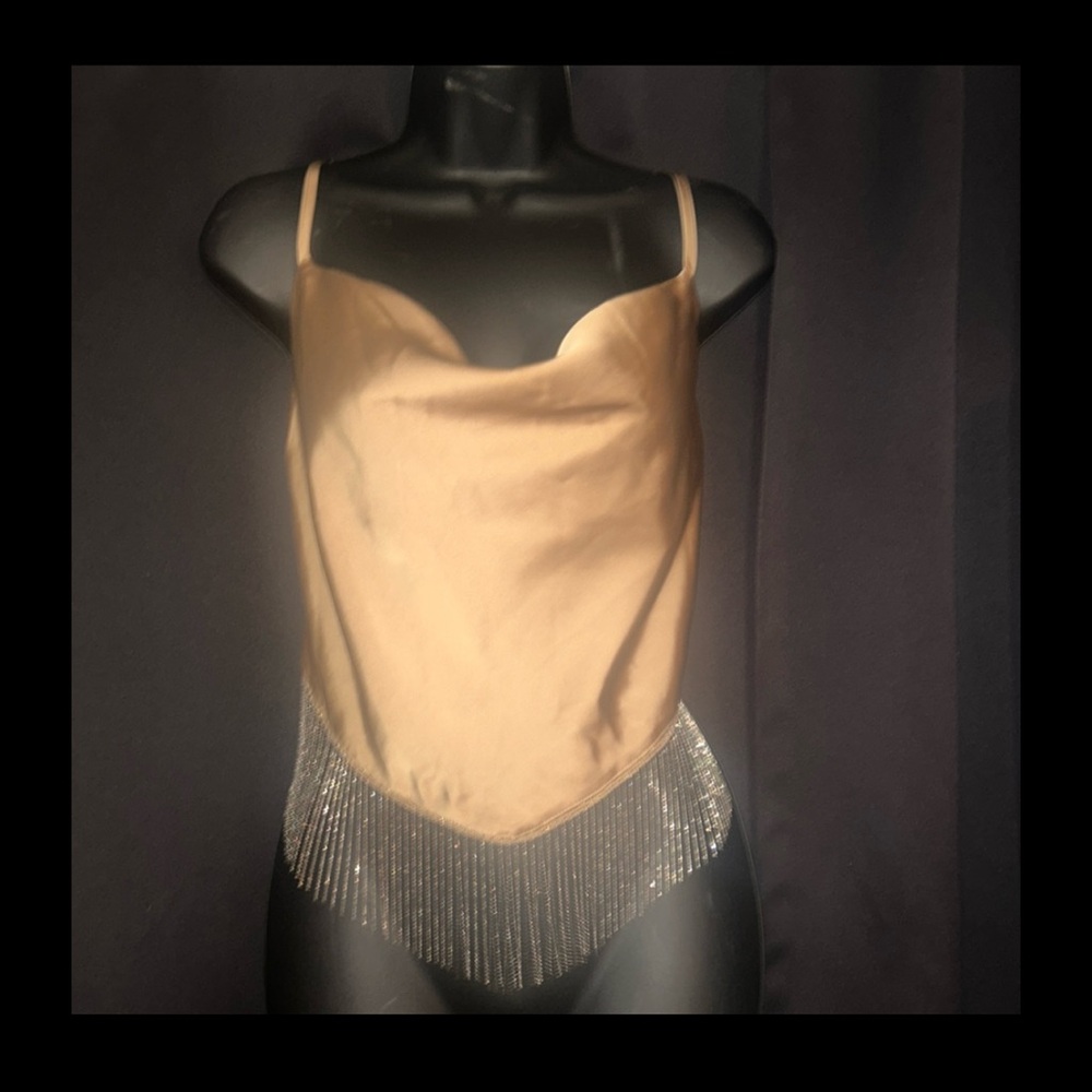 Spaghetti strap silky tank top with rhinestone trim. Size M